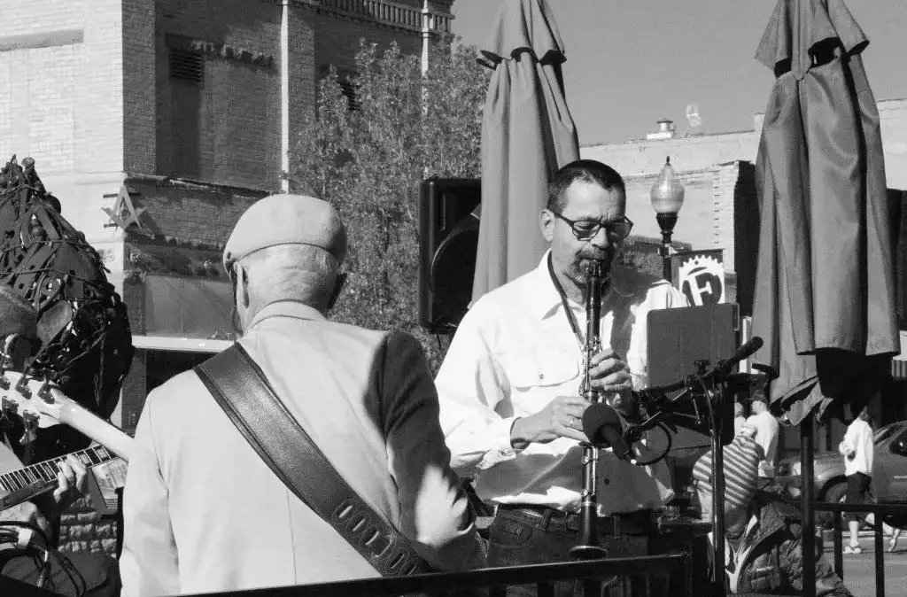 Black and white photograph of Mick Wilson playing the clarinet in Fruita, CO taken by Luke Hanna