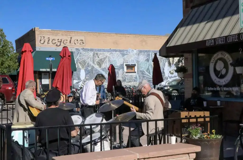 Photograph of PB&J Jazz with guitarist, drummer, bass player, and clarinetist playing outside Aspen Street Coffee in Fruita, Colorado