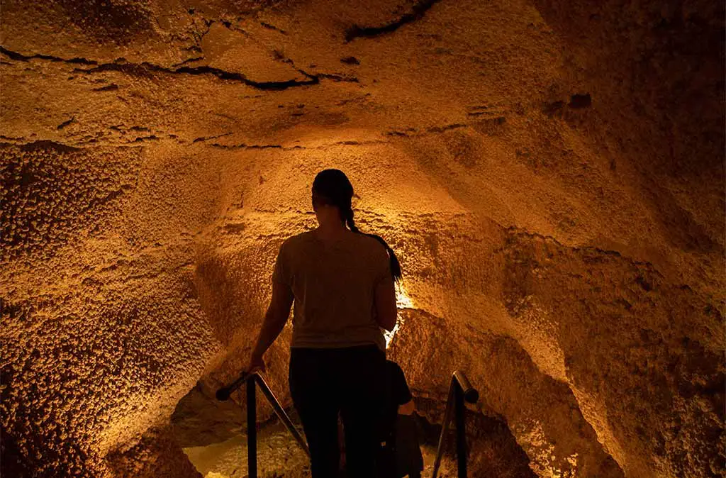 Photo of woman entering a stairway down into the Caverns of Sonora in Sonora Texas