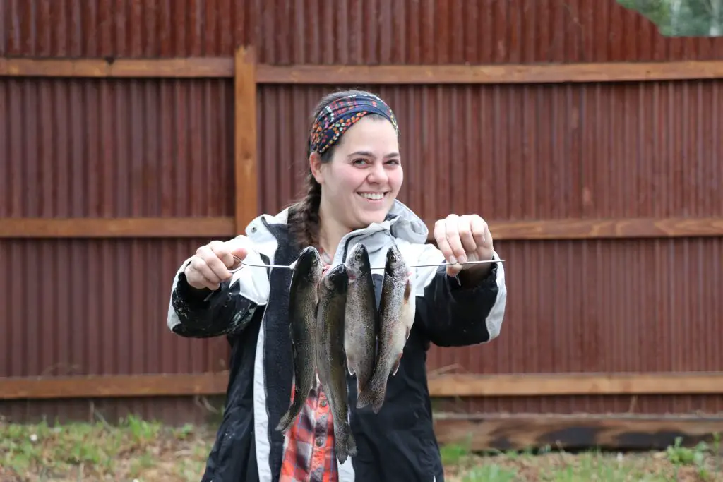 Holding fish that were caught while fishing in Gunnison, Colorado