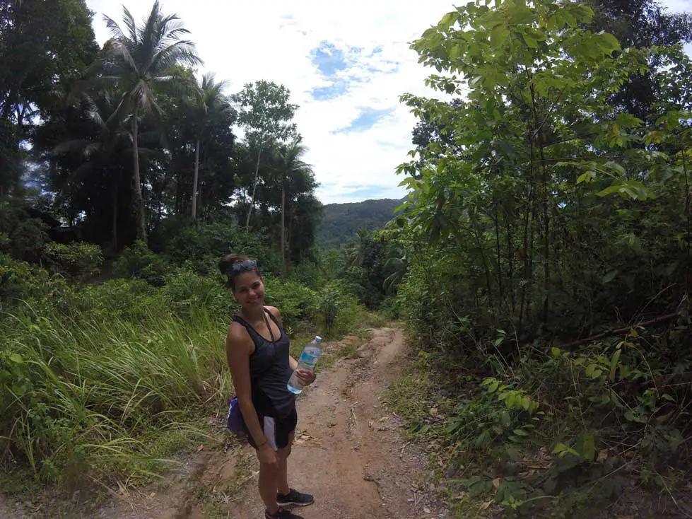 Photo of Stephanie mid-hike to the highest point of Khao Ra Island in Thailand 