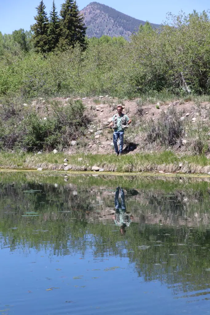 Luke Hanna fishing at a pond at Roaring Judy State fish hatchery