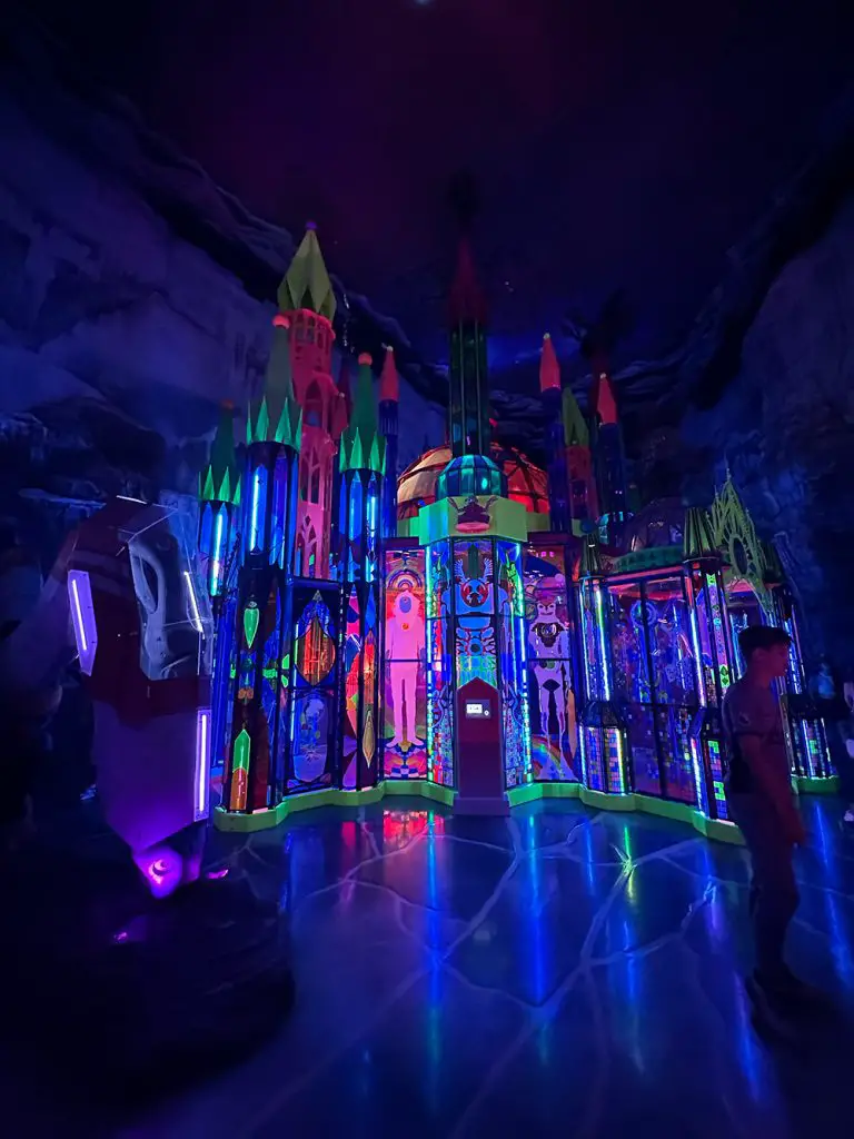 Photo of a bright plastic neon cathedral display in the immersive art museum, Meow Wolf