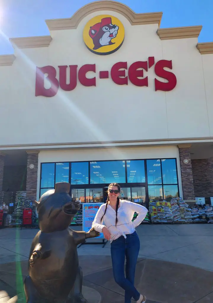 Stephanie posing outside Buc-ee's in  New Braunsfels, TX for her first time at one of these massive convenience stores