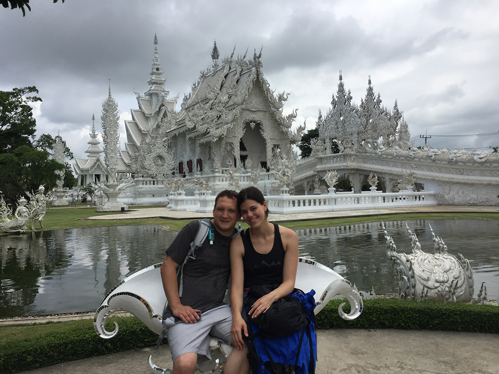 Stephanie and Luke outside of the White Temple in Chiang Rai Thailand for Applied Worldwide blog "A Thai Odyssey: Why This Country Tops The Tourist Rankings"