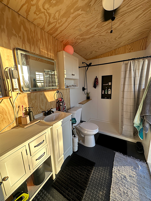 Photo of our finished off-grid bathroom for Applied Worldwide Lifestyle blog "Why We Chose SharkBite Fittings for our Off-Grid Bathroom"