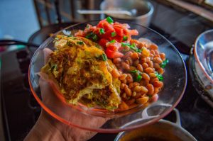 Photo of a Denver omelet with beans and tomatoes