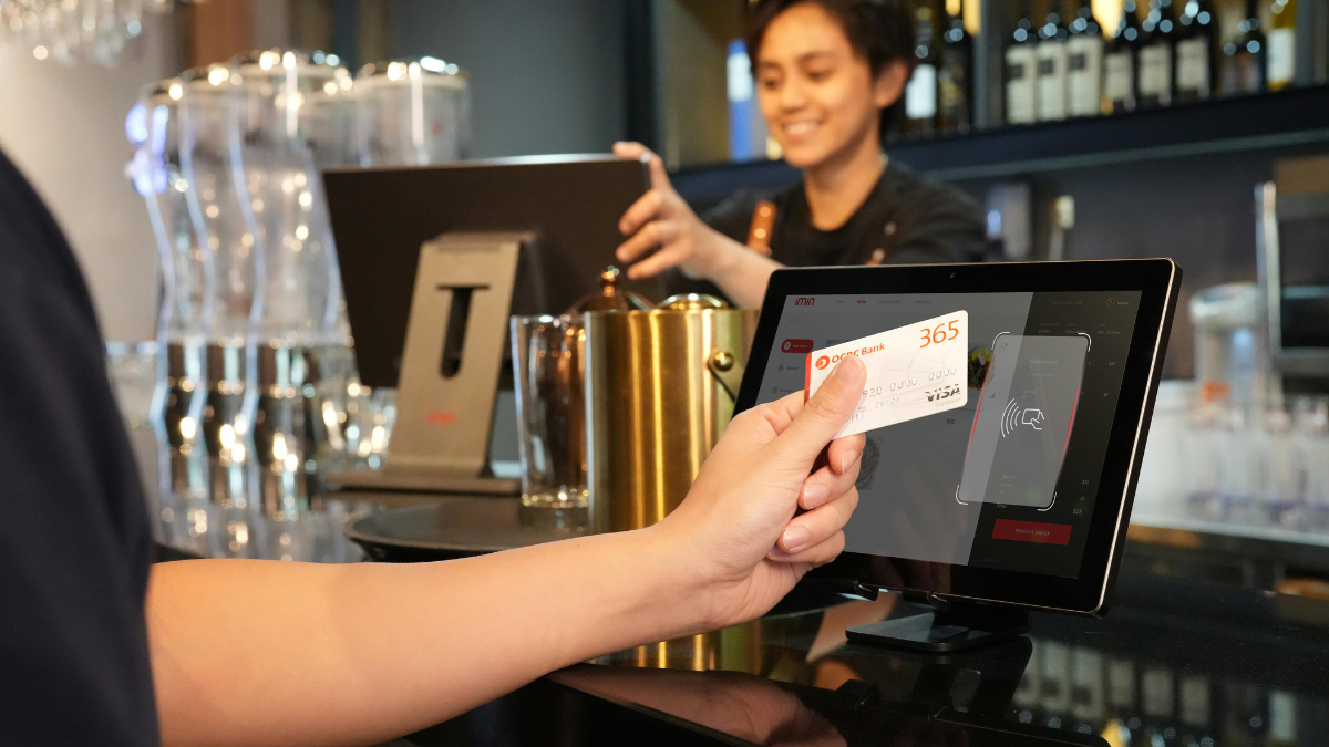 Photo of someone paying at a cafe for Applied Worldwide Lifestyle blog "Top Secret Ingredients for Running a Profitable Restaurant"