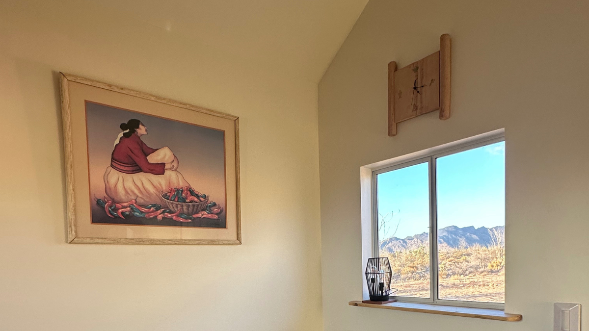 Photo of R.C. Gorman's Chili Peppers hanging on our office wall for Applied Worldwide blog "Buying R.C. Gorman Art at the Thrift in Arizona"