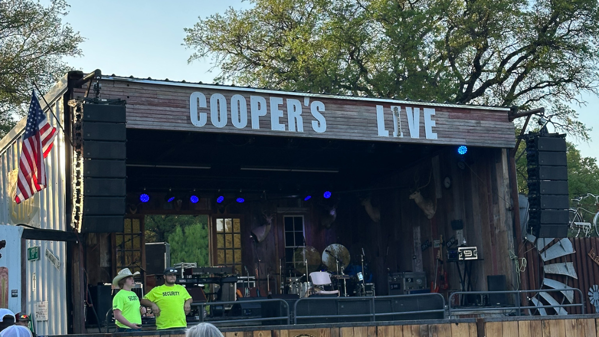 Photo of the stage at Cooper's BBQ Texas Live for Applied Worldwide Lifestyle blog "Cooper's BBQ Live: Brisket, Live Music, and Texas Charm"