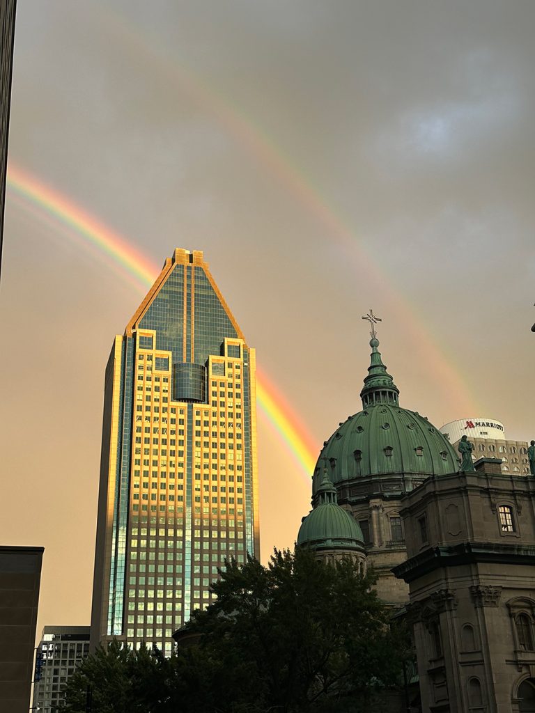 Photo of a double rainbow in Montreal for Applied Worldwide blog "5 Types of Family Vacation Everyone Should Love"