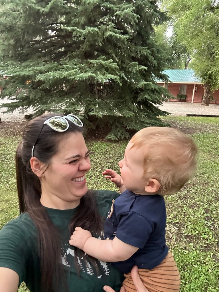 Photo of Stephanie and her nephew enjoying the parts at Island Acres Resort in Gunnison, CO for Applied Worldwide blog "5 Types of Family Vacation Everyone Should Love"