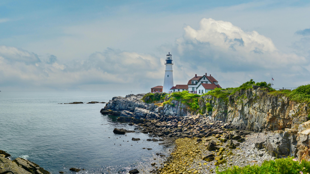 Photo of a lighthouse on the coast of Maine for Applied Worldwide Lifestyle blog "How to Build a Vacation That Recharges and Excites You"