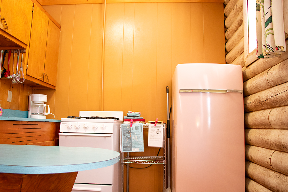 Photo of vintage pink fridge in kitchen of King Suite for Applied Worldwide Lifestyle blog "Island Acres Resort Motel from around the Web"