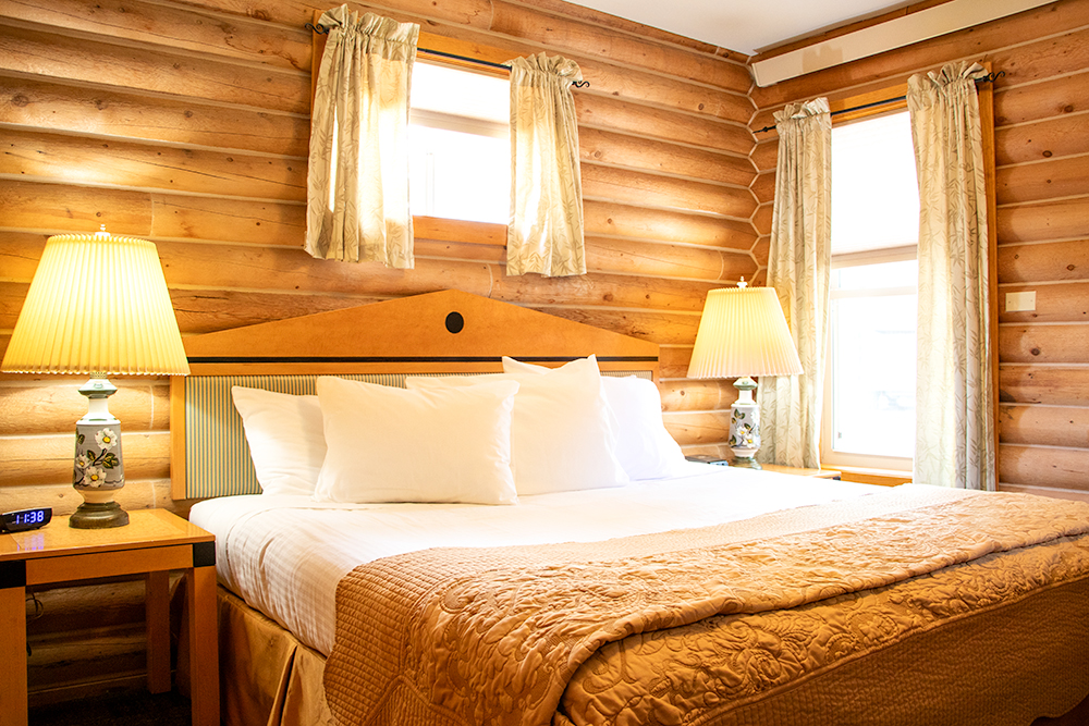 Photo of bedroom in King Suite for Applied Worldwide Lifestyle blog "Island Acres Resort Motel from around the Web"