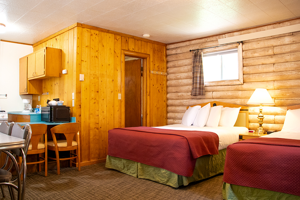 Photo of one of the Queen Studio units in the log-cabin style building at Island Acres Resort Motel